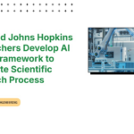 Alt Text: "A researcher using AMD Johns Hopkins AI research tools on a computer, symbolizing automated scientific processes and efficiency."