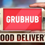 **Alt Text:** A smartphone displays a suspicious login screen, highlighting risks from the GrubHub security breach. Experts advise changing passwords for safety.