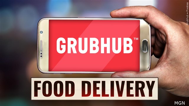 **Alt Text:** A smartphone displays a suspicious login screen, highlighting risks from the GrubHub security breach. Experts advise changing passwords for safety.