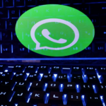 Alt Text: "Close-up of a smartphone displaying a suspicious chat, symbolizing WhatsApp spyware hacking accusations and cybersecurity concerns."